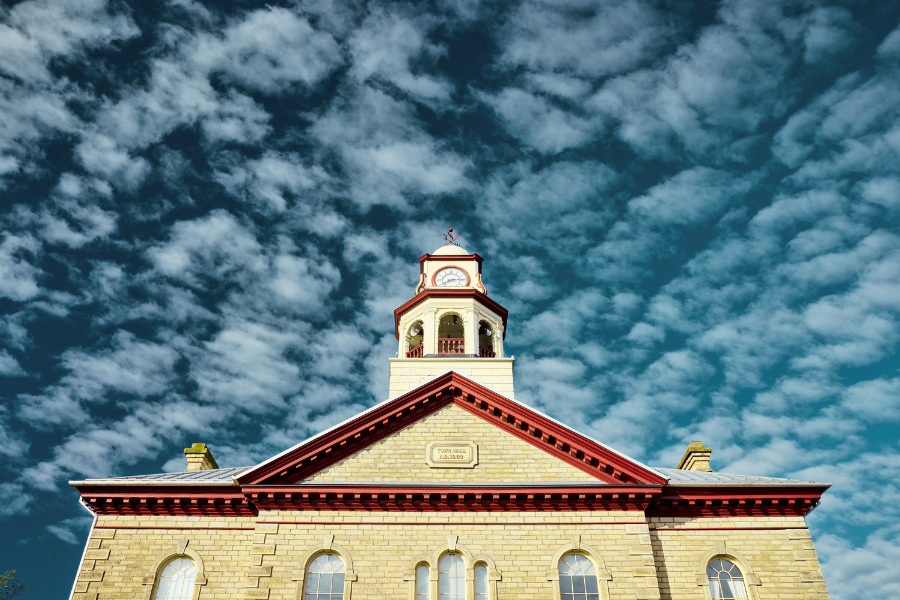 Town Hall clocktower against blue sky and clouds