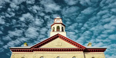 Town Hall clocktower against blue sky and clouds