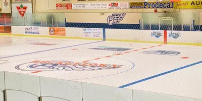 View of indoor ice arena looking towards Centre ice