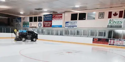 Zamboni going across ice on indoor arena