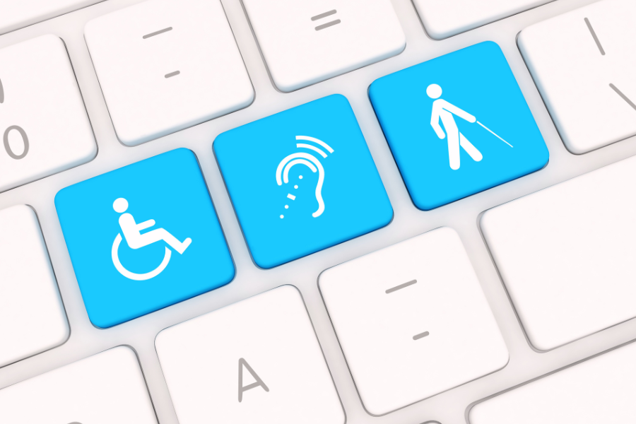 Silver and white keyboard with blue buttons that have icons for mobility, hearing, and visual impairments